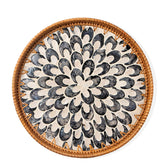 Aayoruro round rattan tray with mother of pearl inlay for an elegant dining display.
