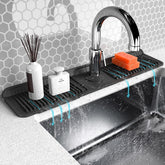 Abulun folding faucet mat behind faucet showing splash guard in place and water direction