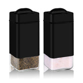 Aelga black salt and pepper shakers with adjustable pour holes for precise seasoning.