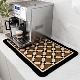 AMOAMI coffee mat hides stains under the coffee maker for a cleaner counter.