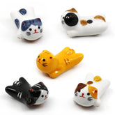AP ARTSPER porcelain cat chopstick rest set keeps utensils neat at meals.