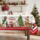 Arquiel Christmas Cats Dogs Tablecloth in red on a dining table, festive scene