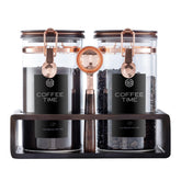 ARTIFORM glass coffee jar set on a wooden stand for organized storage.