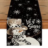 Artoid Mode black snowman snowflake table runner on dining table, protecting surfaces and elevating holiday dining.