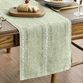 Artoid Mode sage green runner closeup of embroidered stripes for festive tables.