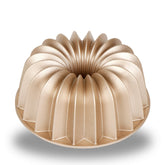 Baker's Secret fluted cake pan showing 9.7 cup capacity for large batches.