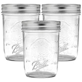 Ball regular mouth 8 oz mason jar front view with lid and band, great for preserves.