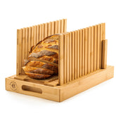 Bambüsi upgraded bread slicer on counter with easy serving tray.