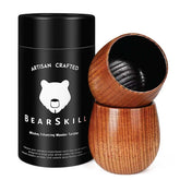 BearSkill charred wood bourbon glass on desk, highlighting rich color and craft.