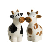 Bicuzat cow salt shaker, hand-painted ceramic, adds playful charm to table settings.