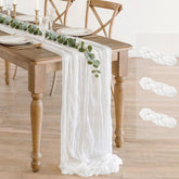BLUETOP cheesecloth table runner laid out on a romantic wedding table
