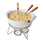 Boska cheese fondue pot set up for a warm cheese dip at a gathering