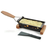 Boska Partyclette To-Go oak frame provides stylish, candle-powered raclette setup.