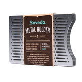 Boveda brushed aluminum holder on a box lid for easy access and freshness.