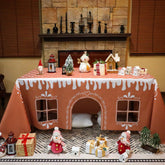 Breling Gingerbread Playhouse tablecloth setup creates an instant festive table transformation.