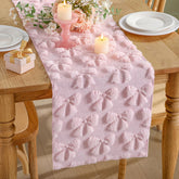 Breling pink bow table runner adds cozy faux fur texture to dining tables.