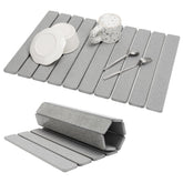 Bunmery large stone drying mat on a kitchen counter showing quick moisture absorption.