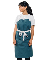 Caldo Daily Cotton Kitchen Apron worn by chef protecting clothes while cooking