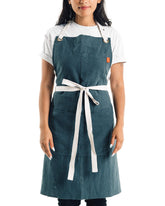 Caldo linen kitchen apron spruce front view with adjustable neck strap pockets