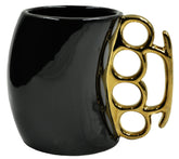 Caliber Gourmet brass knuckles cup in black and gold, bold ceramic mug for collectors.