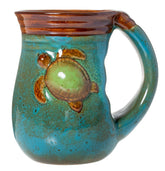 Cape Shore handwarmer mug with turtle design, warm grip for cozy mornings.