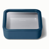 Caraway 10-cup glass container in navy stores leftovers neatly.