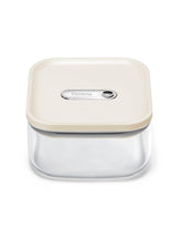 Caraway 1qt glass airtight container with cream lid shows secure seal for fresh ingredients