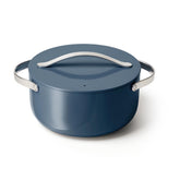 Caraway 6.5 qt navy Dutch Oven with lid, ideal for family roasts and one-pot meals.
