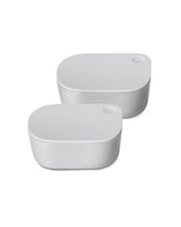 Caraway mini dash inserts with lids for organized lunches and sauces on the go.