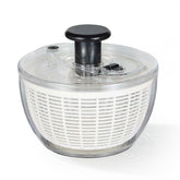CAROTE 3.8 Qt salad spinner with transparent drum showing water droplets for thorough cleaning.