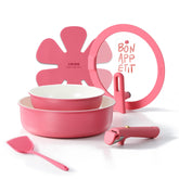 CAROTE pink ceramic pots and pans set on stove for everyday cooking.