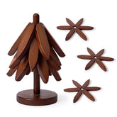 Casa/Legno tree-shaped trivet set on counter protects surfaces from heat