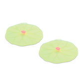 Charles Viancin Lilypad drink covers on a glass forming an airtight seal.