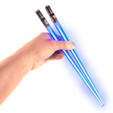 ChopSabers light-up blue lightsaber chopsticks glow for dramatic sushi nights.