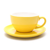 Coffeezone latte art cup in matte yellow showing a stable pour for latte art