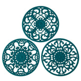 Colinda trivet teal set of 3 with decorative designs protecting countertops.