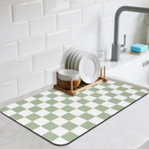 CooRug checkered dish drying mat 16x24 on a green counter, absorbent and practical.