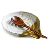 Cormomu ceramic spoon rest on stovetop keeps utensils organized and counters clean.