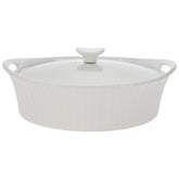 CorningWare French White oval casserole with glass lid, ideal for oven-to-table use.
