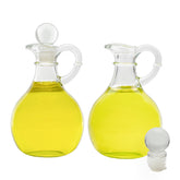 Cornucopia Brands glass oil and vinegar cruets set of 2 with clear visibility for dressings.