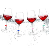 Crayline floating wine glasses with pool charms on water, ideal for poolside entertaining.