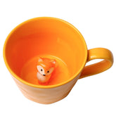 Cteaffee mug with 3D fox inside peeking, perfect for playful coffee moments.