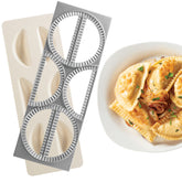 CucinaPro Pierogi Maker with tray-press creates six dumplings at once.
