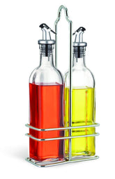 Cuisinox oil bottle cruet with wire caddy and pour spout for table service.