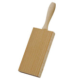 Cuisinox wooden gnocchi board ridges help sauce cling.