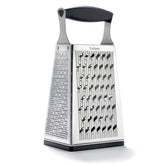 Cuisipro stainless steel 4-sided box grater with handle for effortless, versatile grating.