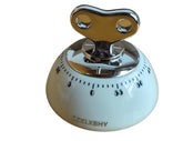 CZXLXBHY kitchen timer with magnetic back attached to fridge for hands-free timing.