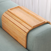 Danfoxer sofa arm tray in natural bamboo, foldable for compact storage.