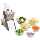 DASH Safe Slice mandoline grey front view with safety guard for precise slicing.