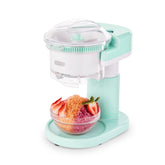 Dash Shaved Ice Maker on a clean countertop showcasing space-saving design for easy home use.